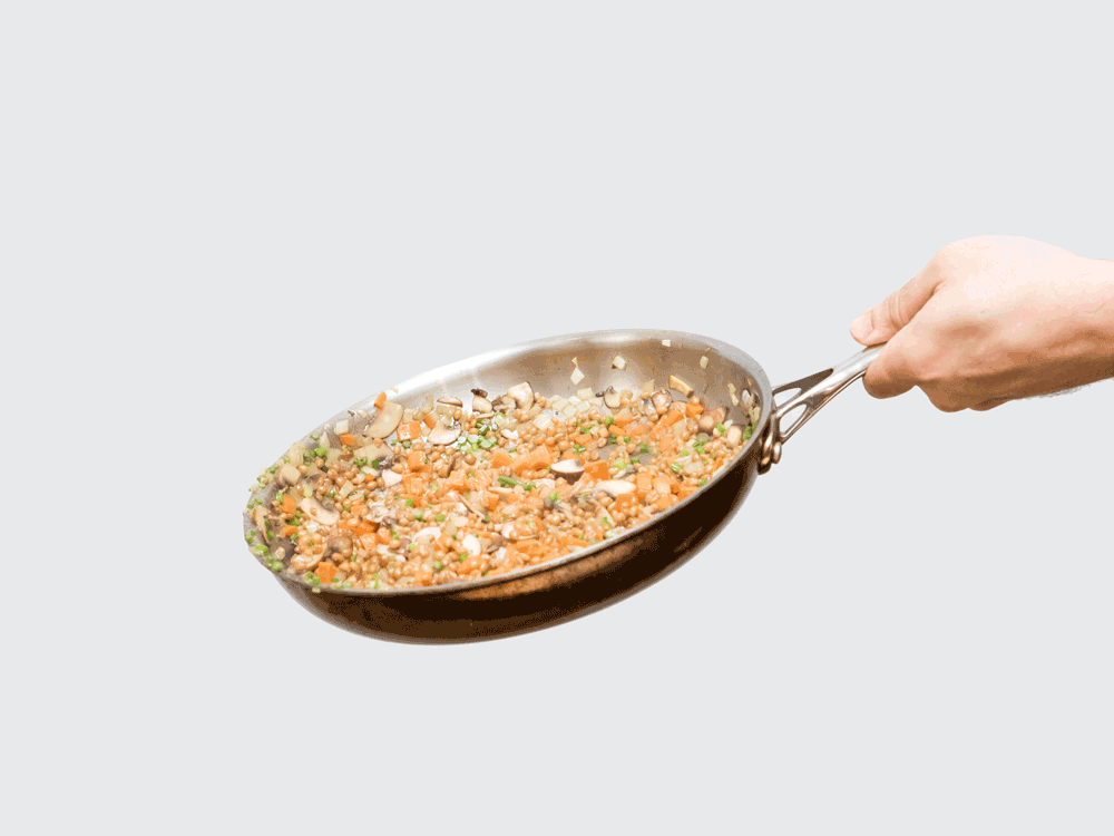 The more liquid you are using, the higher the sides of your pan should be. This may seem pretty straightforward, but deciding when to use a skillet (i.e. fry pan) or a sauté pan can be something of a toss up. The skillet's light weight and sloping sides are designed for easy maneuvering over high heat. Flipping, shaking, and swirling isn't just for style, either: doing so keeps everything cooking evenly. A sauté pan's high walls reduce splatter and mess, so these are best for cooking in sauce or lots of oil. Above: If you want to learn how to toss food in a skillet, check out the tutorial on Serious Eats. Then try out your new skills with 39 Delicious Things You Can Make In A Skillet.