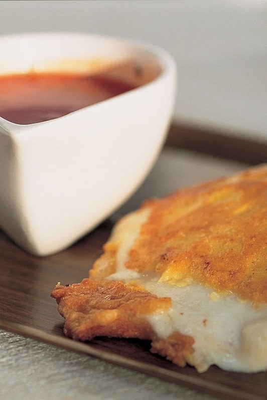 When you need some lovin' that only bread and cheese can provide, swipe right for Mozzarella in Carrozza. Nigella gives it an upgrade we didn't know it needed by dunking it in a mixture of eggs and flour for extra crispness. Once its cooked, 'cut in half and apply to face.' Do as she says, guys.