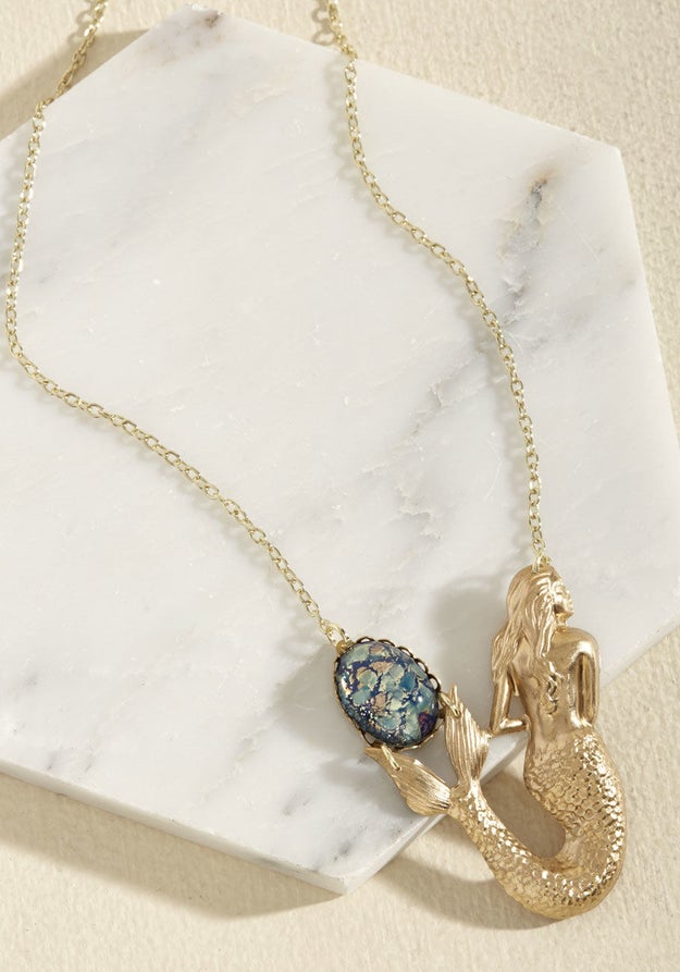 A mesmerizing mermaid and her exquisite stone that'll serve as your own enchanting trinket.