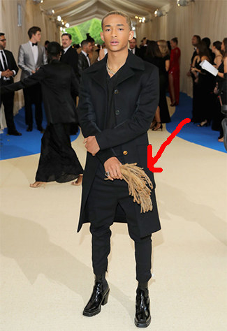 Perhaps you noticed he's carrying something in his right hand? Yup, that's his dreadlocks.
