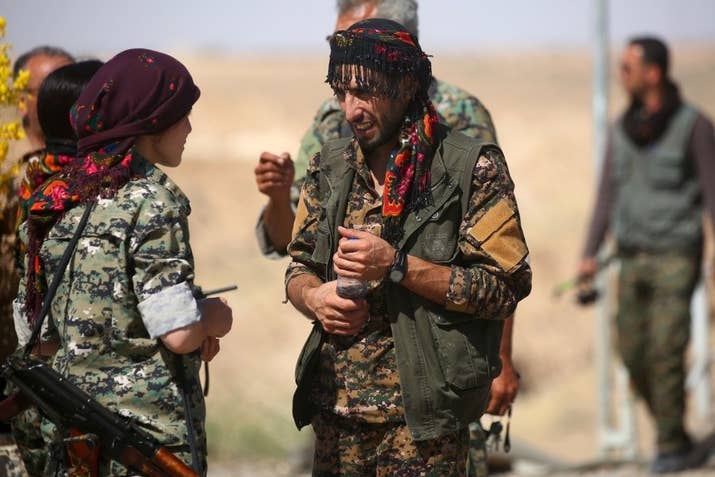 Members of the US-backed Syrian Democratic Forces (SDF) gather at the Tabqa dam. Delil Souleiman / AFP / Getty Images