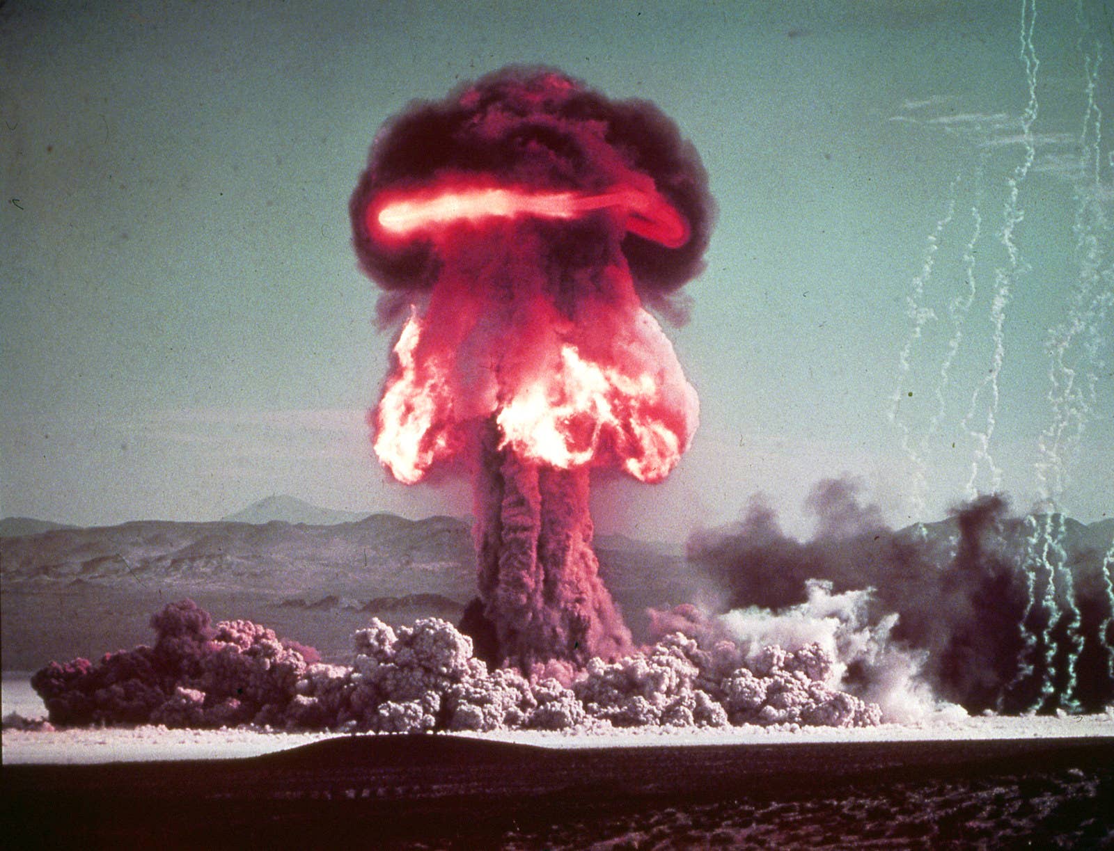 A mushroom cloud forms after the detonation of nuclear artillery shell Grable at the Nevada Proving Grounds on May 25, 1953.