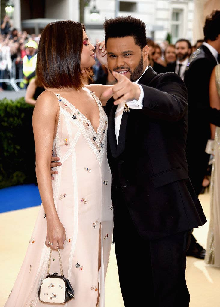 Selena Gomez Embraces The Weeknd During Their Red Carpet Debut at