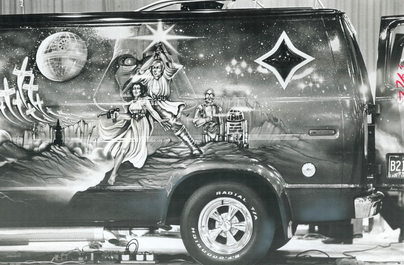 A fan's van is painted with a Star Wars mural depicting the film'...