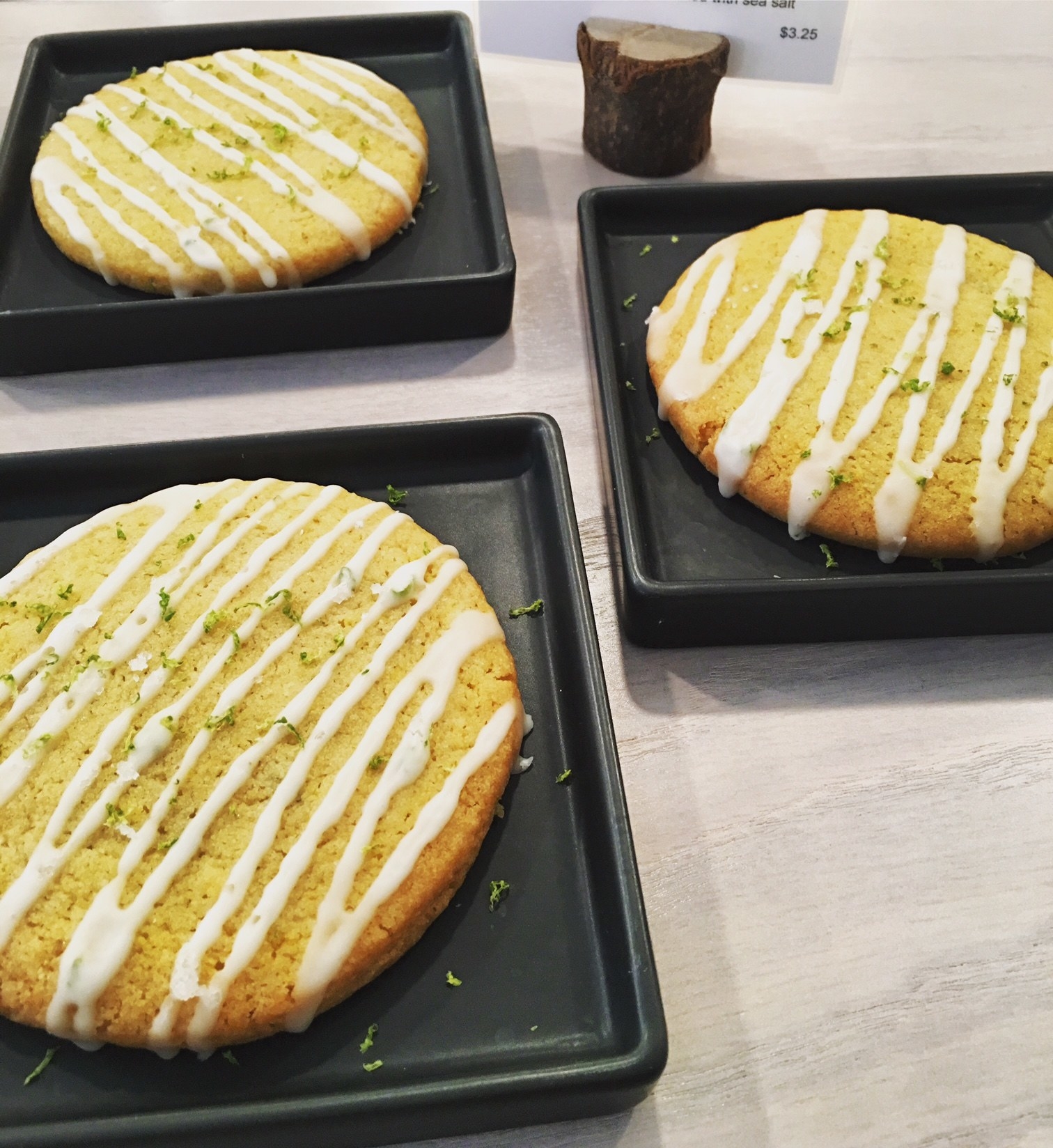 Chewy cornmeal cookies are drizzled with a zesty lime glaze and garnished with sea salt for an interesting balance of sweet and salty.