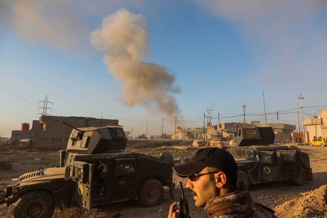 Soldiers respond to a suicide car-bomb attack in Mosul.