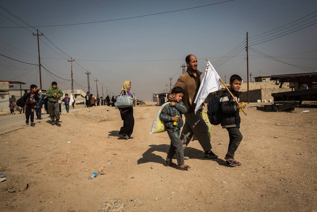 Civilians flee the fighting in Mosul.