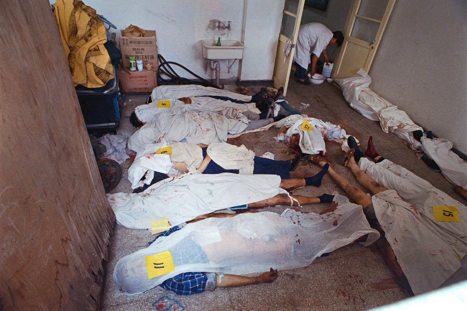 Killed demonstrators are gathered in a makeshift morgue on June 4, 1989.