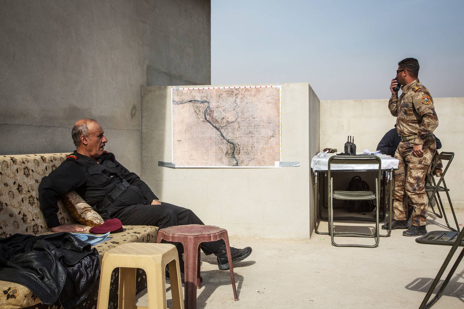 Col. Arkan (right) coordinates airstrikes in Mosul.