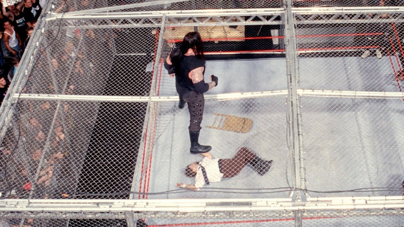 Remember how i said we would be getting to "Hell in a Cell" ? well here we go The Phenom has been in a countless Hell in a cell matches with the Likes of Kane, Shawn Michaels Cm Punk , but it was the one at King of the ring 1998 against Mick Foley (mankind) that stands out the most for me, and i mean for obvious reasons. Well for starters it was in Pennsylvania !! (my homestate) and secondly UNDERTAKER THREW HIM OFF THE TOP INTO THE ANNOUNCERS TABLE ! Not to the discredit of Mick foley who was carted off and climbed back up only to receive a chokeslam threw the top of the cage . This is hands down one of the greatest matches in wrestling History surrounding the Deadman himself .