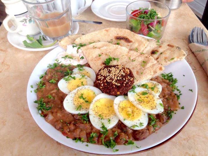 I know I said that I wouldn't judge the food based on anything other than the food itself, but you should probably know that I waited for an hour and a half for this meal. It was a sunny Sunday afternoon, and fellow brunchers were waiting outside. The clock moved super slowly, and I watched as diners took their sweet time and people behind me in the line-up walked away to get Pizza Pizza.You can probably guess that by the time I was seated, my expectations were sky-high. Maha's, however, did not disappoint. I didn't hesitate to order some Egyptian black tea and the Cairo Classic, a traditional breakfast dish with fava beans with tomatoes and onions, sliced hard-boiled egg, a falafel, a scoop of homemade feta cheese with tomato, balady bread (Egyptian flatbread, with two layers that can be torn), and salata baladi (Egyptian salad with tomatoes, cucumbers, and peppers). The foole, mashed fava bean stew, was spiced beautifully, and paired so well with the charred balady bread, crispy falafel, and fresh vegetable relish. Their menu is quite extensive, with all kinds of delicious dishes like date grilled cheese and vegan lentil soup.My only complaint, aside from the long wait? More falafel, please! Definitely one of the best I've ever had.