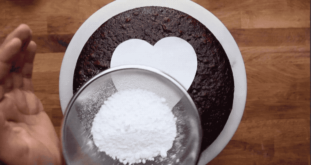 Trace your favorite cookie cutter onto paper and cut it out to create stencils for dusting cocoa or powdered sugar onto cakes.