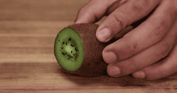 Slice the ends of a kiwi off and use a spoon to easily separate the fruit from the skin.
