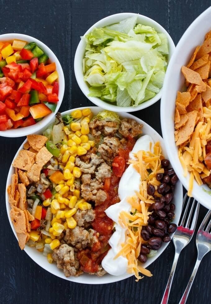 Grocery list-1 lb. ground turkey: $5.99-1 package taco seasoning: $0.99-1 head iceberg lettuce: $2.99-1 can black beans: $0.99-1 onion: 0.79-2 peppers: $1.79-1 can corn: $1.59-1 bag shredded cheddar: $2.99-Salt and pepper: Pantry staplesTotal cost: $18.12Get the recipe.