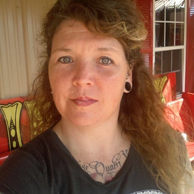 If you're SunShine McCurry, a tattoo artist living in Forest City, NC, who came downstairs and found a five-foot black snake hanging out in her living room, you HANDLE THAT SITUATION.