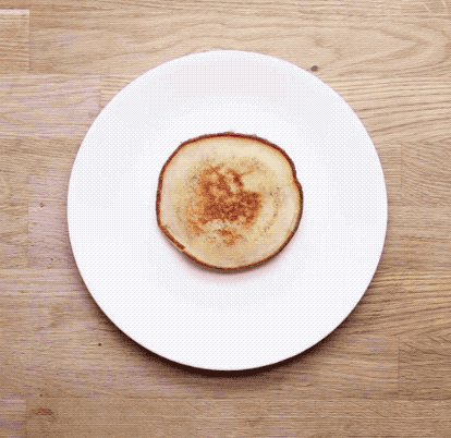 To build:Place halved strawberries above the pancake as ears, as well as one below it for the body. Place mandarin orange segments on either side of the body as arms. Place raspberry halves below the body for feet, and use the blueberries to create the eyes and nose.