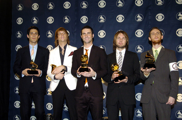 Maroon 5 is an American rock-pop band that rocks my pops off. Not only do they go "beep boop ker-powie" on the guitar, they're also dumpster divers! Here they are pictured after a successful night scurrying around in the garbage outside their back porch. Who knows besides these 5 beautiful men what those shiny objects they're holding could be! Maybe they're a toothbrush, a lint roller, a garden hose? Honestly, could be anything.