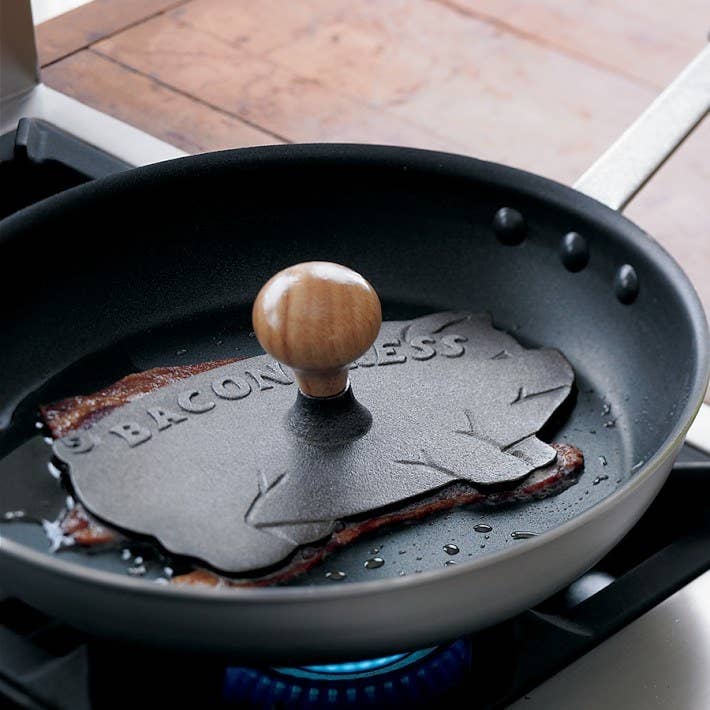 Promising Review: "Just love this cheerful guy. Used him this morning for the first time — really long, thick bacon did not curl up and cooked perfectly." —IloveNY4everGet it on Willams-Sonoma for $15.