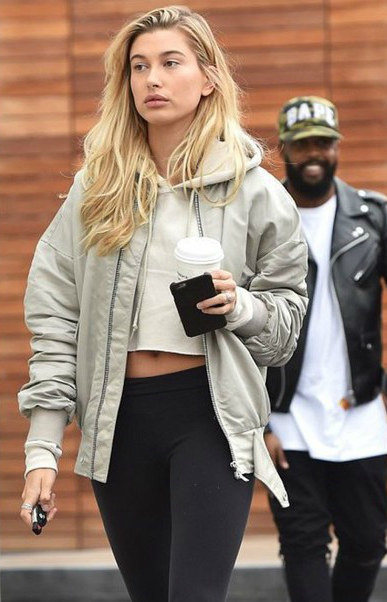 Get another athleisure look but with a twist as you wear the most fun and rocker chic ensemble for the airport trip. Make sure to try something offbeat as you layer your hoodie sublimated sweatshirt or jacket with complementing joggers and an appliquéd bomber jacket for a laid back, and comfortable look.