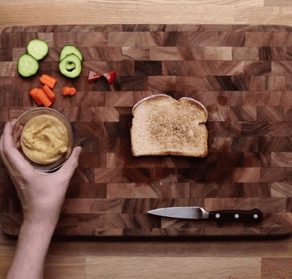 To build:Spread toast with hummus and place scrambled eggs on top half of toast. Place whole slices of cucumber under each side. Place the remaining two slices of cucumber (with centers removed) as eyes and fill each with a round of carrot. Place remaining baby carrot (cut in half lengthwise) between the eyes and finish with a bell pepper bowtie.