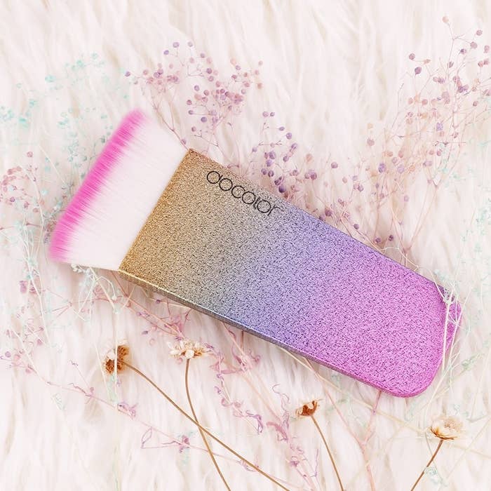 Promising Review: "This flat contour brush is AMAZING! The brush looks so pretty with the glitter and bright colors. The brush tip is pink and beautiful. The brush works great, too. You get very straight lines and a sharp contour. Bristles are very soft and it's so affordable!" —MargieGet it from Amazon for $9.