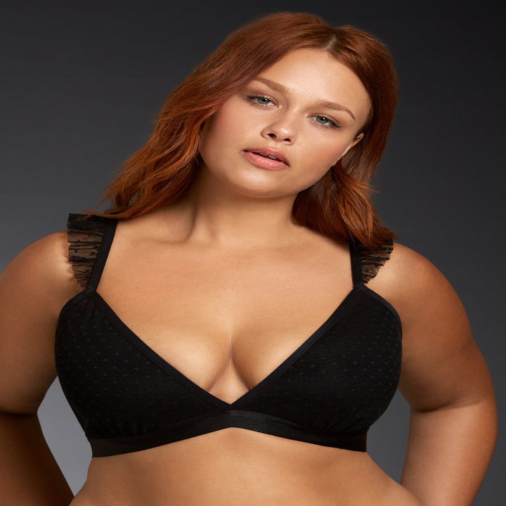 a model wearing a black triangle bralette