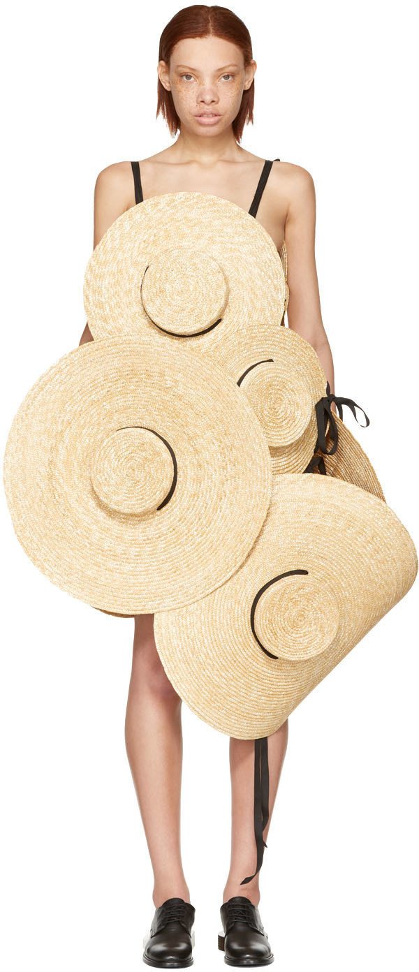 IF SO, HAVE I GOT A TREAT FOR YOU! Behold this truly never-before-seen creation, a dress made out of nothing but eight straw hats.
