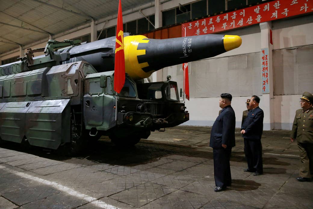 North Korean leader Kim Jong Un inspects the long-range strategic ballistic rocket Hwasong-12 (Mars-12) in this undated photo released by the state-run Korean Central News Agency on May 15.