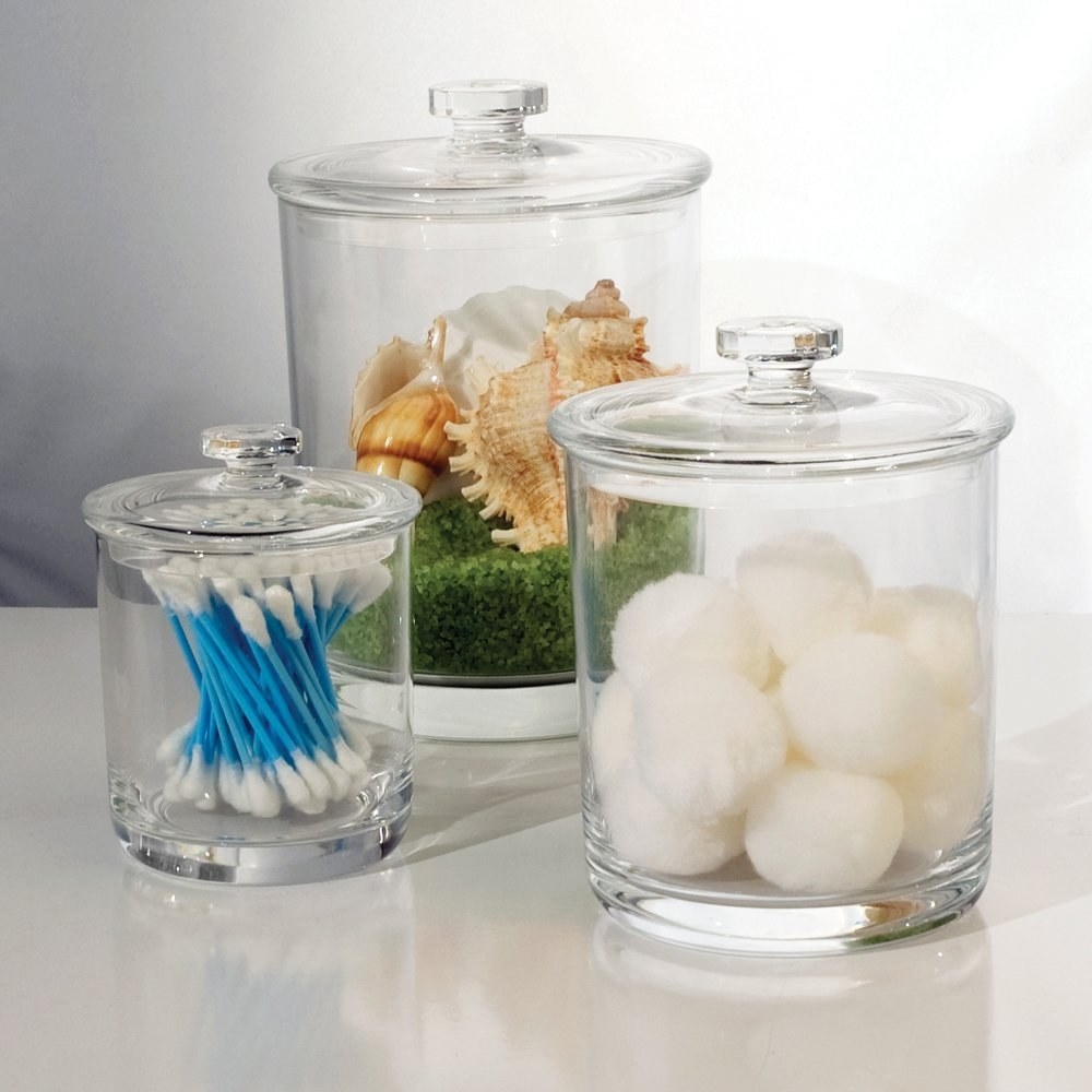 The set of jars filled with cotton swabs, balls, and decor