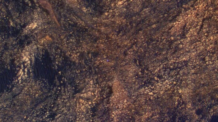 Here it is earlier this month as a tiny blue dot on its way up Mount Sharp.