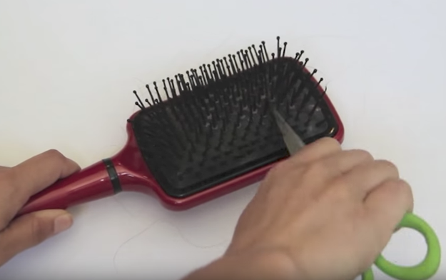 Cleaning out all the hair from your hairbrush.