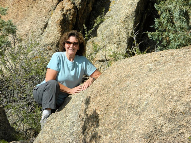 When most of us go hiking, we may wear a cute pair of cargo khakis, some thick white socks, a casual blouse, some sweet shades, and our "dirty" boots. We may even straddle a rock or two. You're crazy, lady!