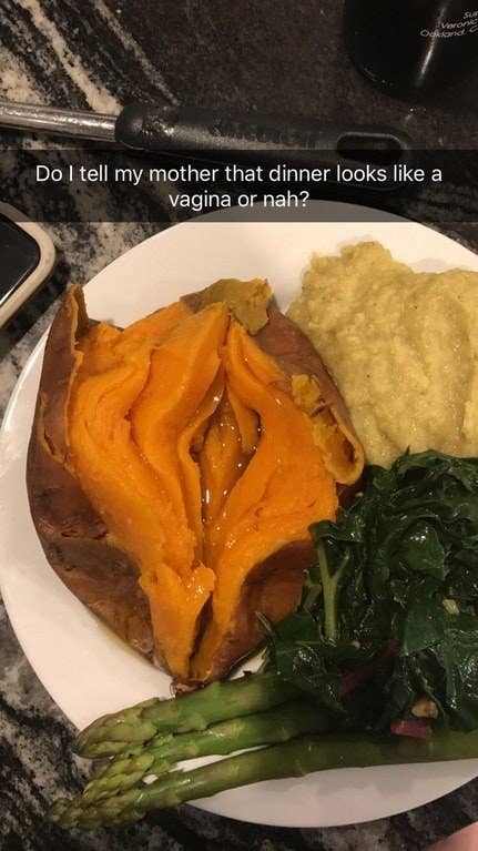 A buttered yam split in half