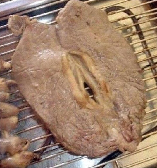 A thin piece of steak with a hold in the middle