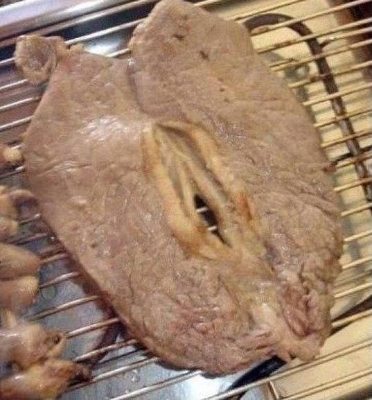 A thin piece of steak with a hold in the middle