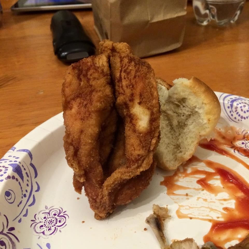 A piece of fried chicken with a deep space in the middle