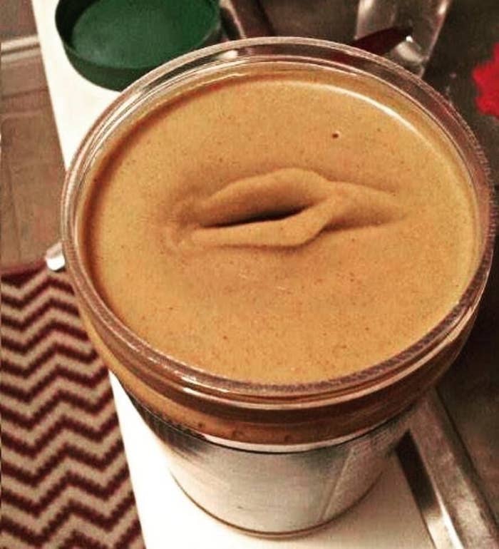 a jar of peanut butter with a hole in the middle