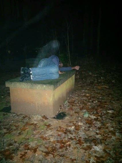 "This is a photo of my uncle that my mom took one night in a cemetery by a bar they were at. He is lying on a Revolutionary War-era grave."—kelseywinecoff
