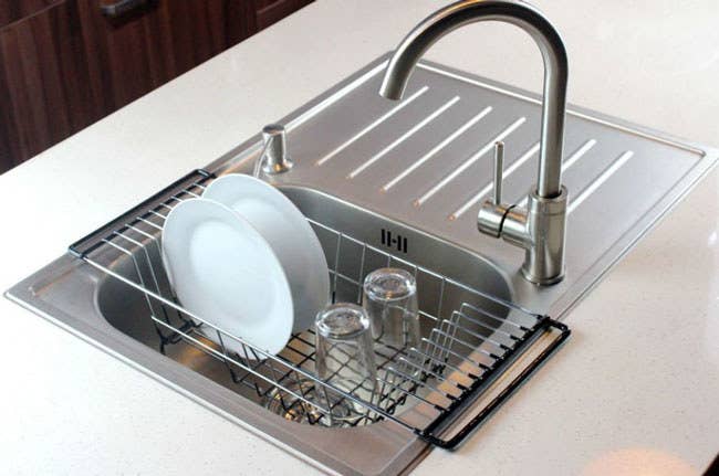Promising Review: “Sinks come in many sizes, and finding a dish rack to fit mine was quite the endeavor. I looked at many different racks on Amazon to try to find one to fit the smaller side sink in my kitchen. This over-the-sink drainer rack worked perfectly. It is well-made, good-looking, and fits just right! I will often wash a glass or dish by hand, and this allows me to let them dry in the rack. I don't get too excited about items like this. But when something works, is made well, and looks great, then I get happy!” —Frank Get it from Amazon for $18.87.