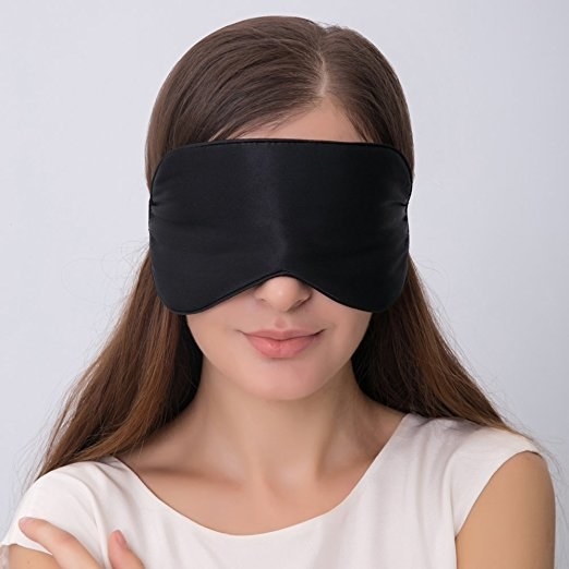 A model wearing the eye mask