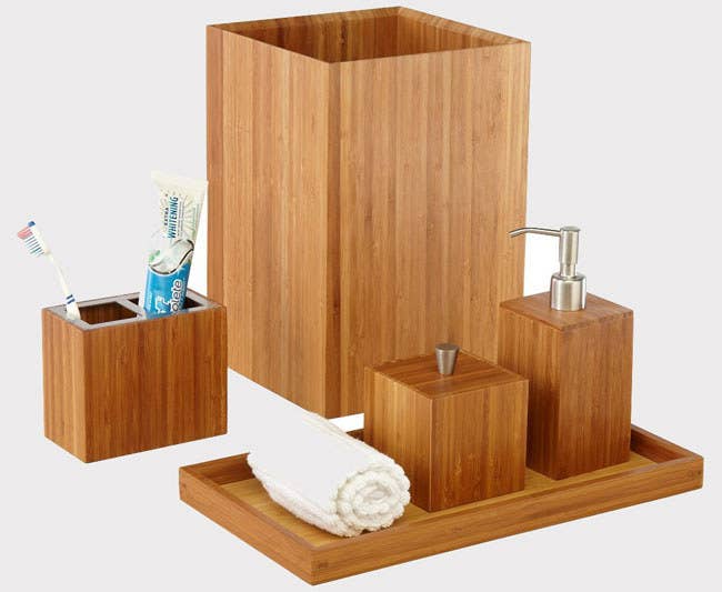 The set includes one dispenser with a brushed stainless-steel pump, one cotton swab box with a lid, one toothbrush holder, one wastebasket, and one towel holder tray. Promising Review: “This set is lovely, well-constructed, and looks expensive. The wastebasket is medium-size and very adequate. Unless, of course, you are lax in emptying the wastebasket. If you want a bamboo set, this is a great choice at a great price!” —Marsha S Get the five-piece set from Amazon for $44.99.