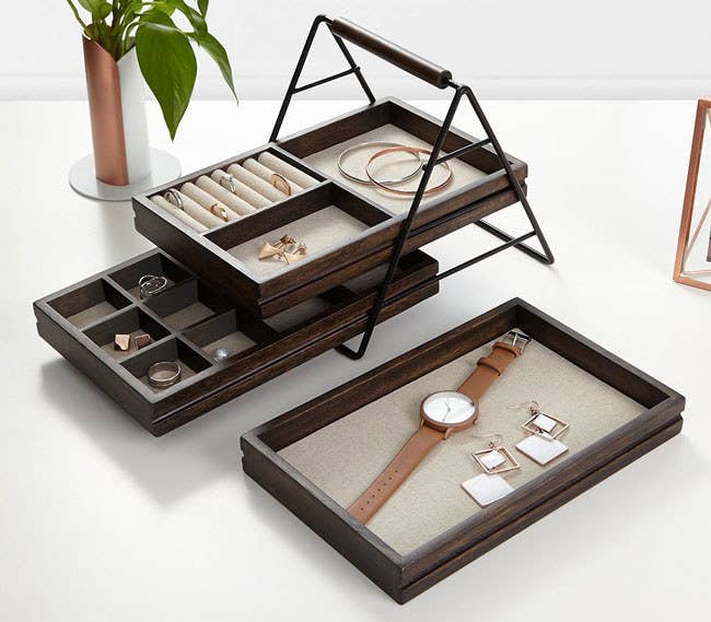 Promising Review: “This tray looks great on top of my dresser and is just the right size. It doesn't take up too much space and holds a lot of jewelry. I also love the sliding trays and how easy it is to access everything. I’m so happy I purchased this!” —J. Grady Get it from Amazon for $29.99.