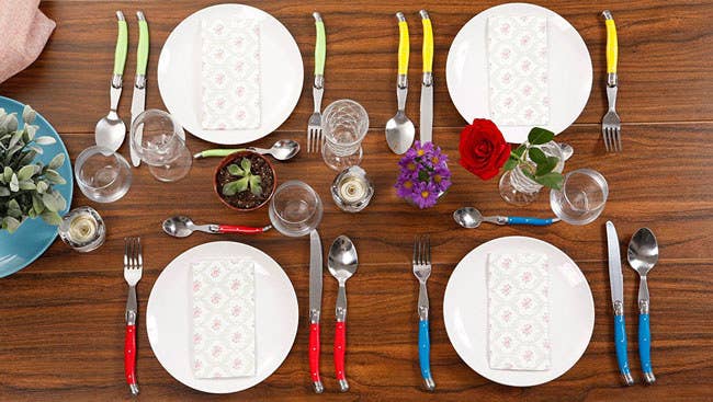 The utensils are dishwasher-safe, but hand-washing is recommended. Includes two salad servers and a 32-piece set of dinner forks, knives, tablespoons, and teaspoons. Promising Review: “I needed some extra flatware and couldn't decide what to get. I finally chose this bright set because it makes me happy. They were well packaged. And the detail I like most about the construction is that the stainless steel runs all the way from top to bottom, so the blade is not going to fall off in the middle of your steak!” —Amelia Earhart Get the 43-piece set from Amazon for $49.99 (available in two colors).