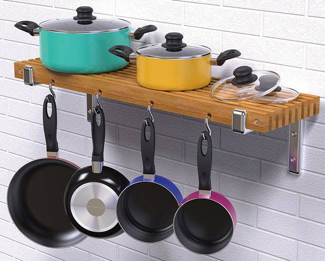 The cookware set includes three saucepans with glass lids, a stockpot with a glass lid, frying pan, slotted spoon, slotted spatula, pasta server, ladle, and potato masher. Promising Review: “These pots are very pretty, heavy and large. I love the shape at the top because it helps prevent water boiling over them!” —Diane Harding Get the 15-piece set from Amazon for $42.99 (available in two colors).