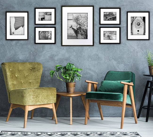 Promising Review: “I purchased this set a few months ago, put the frames in a closet, and have been dragging my feet to get pictures printed. I finally opened the box and was shocked to find there was already artwork included! The photos are actually really nice, so I decided to hang the frames up with the included art. The templates made them really easy to hang. Just cut them out, tape them to the wall, so you can get a feel for how you want it arranged, and make the holes right over the paper. I decided not to use the anchors and opted for small nails instead. They are pretty lightweight, so I don't foresee any issues with not using the anchors.” —Diana Get the seven-piece set from Amazon for $33.32.