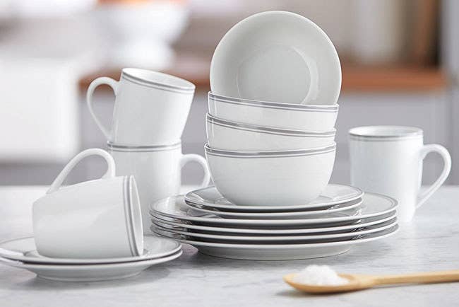 The dinnerware set includes four dinner plates, four dessert plates, four bowls, and four mugs.Promising Review: “These dishes are sturdy, and the color representation from the online picture to the actual product is very accurate. The bowls, though smaller than the ones I had before, will be wonderful for controlling soup and cereal portions. I also love the size of the salad plate, and the mugs are a decent size. If you enjoy a hefty cup of coffee in the morning, these won't be for you. But for entertaining or the occasional tea or hot chocolate drinker, these mugs are the perfect size. The handles are the kind that are easy to rest your thumb on top of, too. So that's another plus!” —Kaela Get the 16-piece set from Amazon for $27.99 (available in four colors).