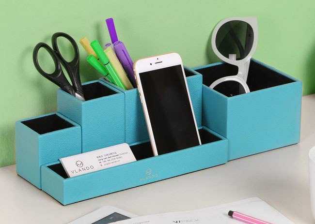 Promising Review: “I was very excited to get this item and decided to toss my old mesh desk organizer as soon as I took it out of the package. It looks so perfect! It has five divided parts that can easily be arranged to fit any desktop area. It can also hold more office supplies than other desk organizers I’ve owned.” —Ken Get it from Amazon for $15.99+ (available in eight colors).