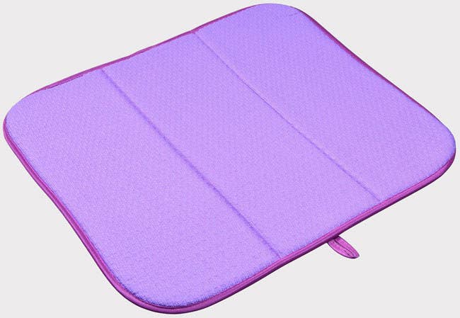 The mat also folds up easily for swift storage once your items have dried off. Promising Review: “I love this mat! Every time I look at it, I think about all the years I spent using drainboards — which get icky. I actually have a huge corner behind my sink, so I have two of these. I find them to be so much better than plastic drainboards. Recently, I spilled some mouthwash on them and easily washed them in the laundry. This is a terrific product and I will never go back to those plastic drainboards!” —Kiri Corr Get it from Amazon for $9.14 (available in 12 colors).