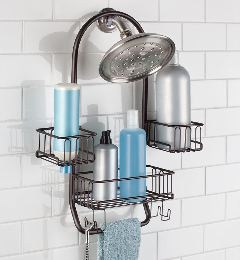 Get it from Amazon for $19.99. Available in three finishes.Promising review: "This caddy is perfect for anyone with large shampoo/conditioner bottles! I have large Paul Mitchell bottles with pumps and always had to set them on the rim of my tub — but not anymore! This is really sturdy, and I was even able to fit another large bottle in the middle spot along with my face and body washes. I also really like that there are two razors holders sp I don't have to worry about my razor rusting over because it can't dry thoroughly!" —Amazon Customer