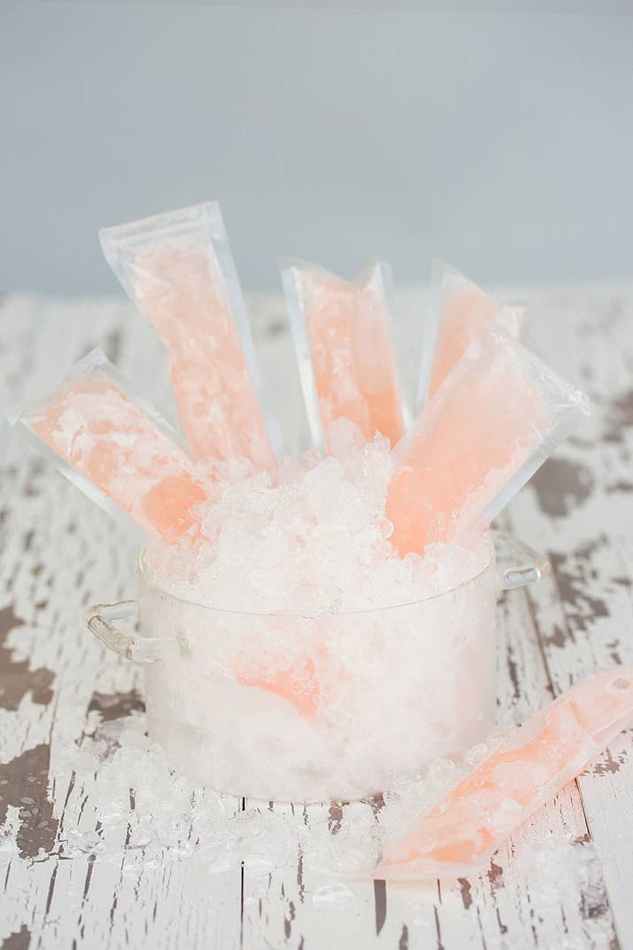 What you’ll need:½ cup sugar¼ cup water1 lemon1 bottle of Cupcake RoséPlastic ice pop pouchesWhat you’ll do:Combine sugar, water, and lemon juice in small pot over medium heat. Once sugar is fully dissolved, remove and cool to room temp. Mix cooled syrup with rosé, then slowly pour into plastic pouches. Leave some room at top of pouch because mixture may expand while in freezer. Freeze for about 6 hours, then enjoy!Makes approximately 12 pops.